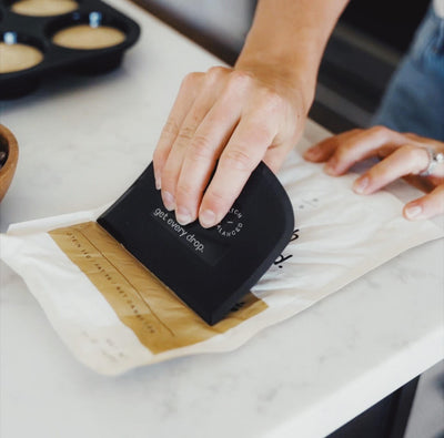 Person using a batter tool filter with text on a white surface